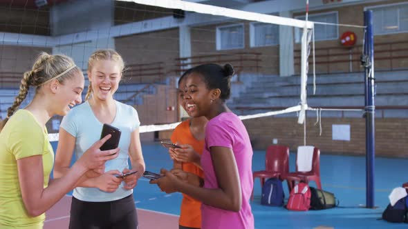 Female players using mobile phone during break 4k alt