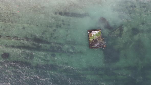 Cargo Ship Standing at Shoal of Sand Beach After Run Aground alt