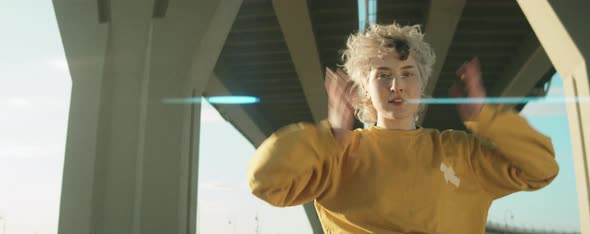 Young Woman Dancing Vogue Outdoors alt