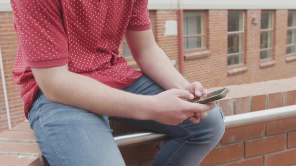 Caucasian high school boy listening to music alt