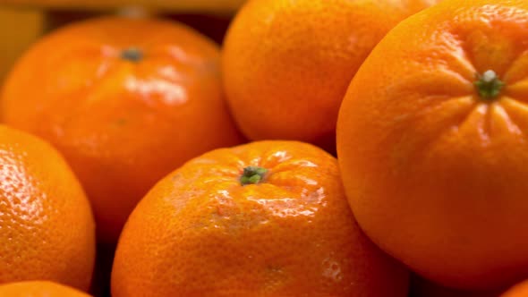Lots of Tangerines on the Market Close-up. The Camera Is Moving. alt