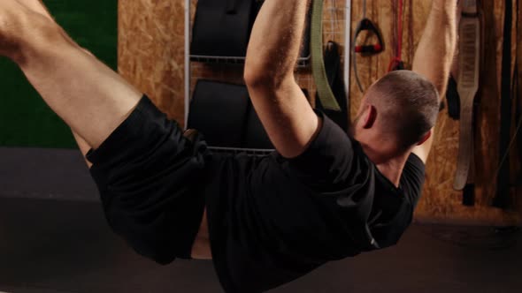 Men Training Arms with Trx Fitness Straps in Gym Doing Push Ups in the Air Train Upper Body Chest alt