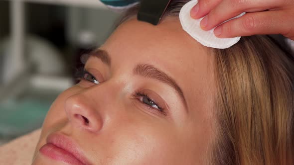 Woman with Flawless Skin Enjoying Ultrasonic Facial alt