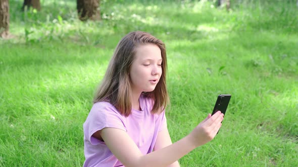 Teenage Girl with Smartphone Having Video Call