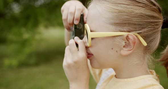 Teenage Pretty Girl Take Pictures in the Park Outdoors with Yellow Retro Dress alt