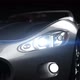 Car in the studio. camera movement from right to left on the front view headlights