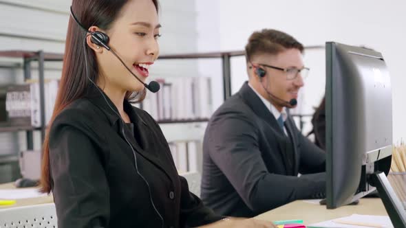 Business People Wearing Headset Working in Office alt