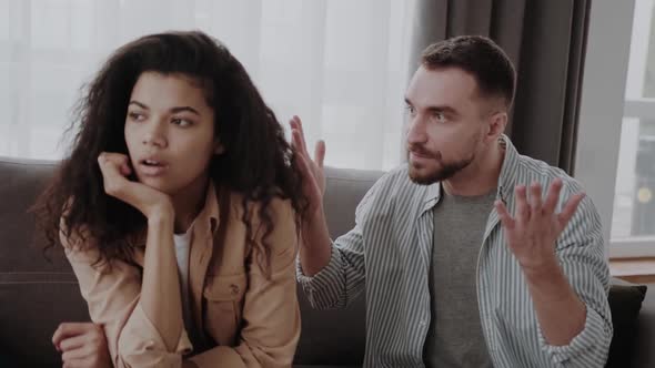 Young International Couple in Quarrel Spending Time Together at Home alt