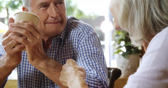 Senior Couple Talking While Having Coffee in The Cafe 4k alt