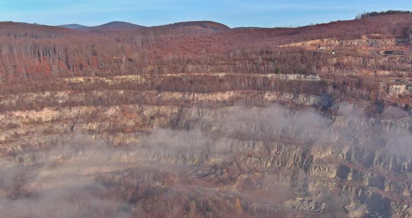 Mining Quarry with Special Open Pit Stone an Opencast Mine Extracting Fog in the Autumn Over the alt