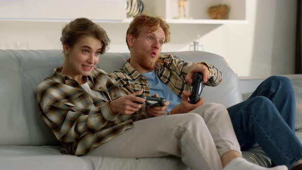Excited Players Enjoying Video Game alt
