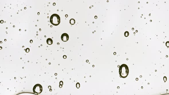 Transparent Cosmetic Gel Fluid Flowing Down on a White Surface alt