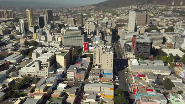 Scenic aerial wide drone shot above Bo-Kaap, Cape Town, South Africa. Tilt-down  with scenic view of alt