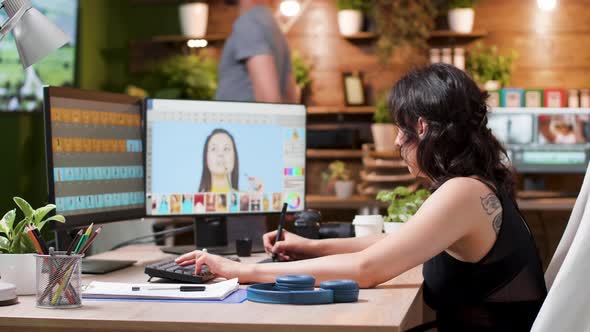 Female Photographer Edits Photos in Creative Media Agency Office alt