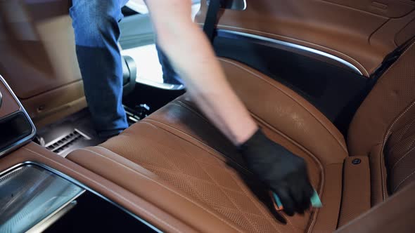 Detailing and Cleaning of Back Seats at Luxury Modern Car alt