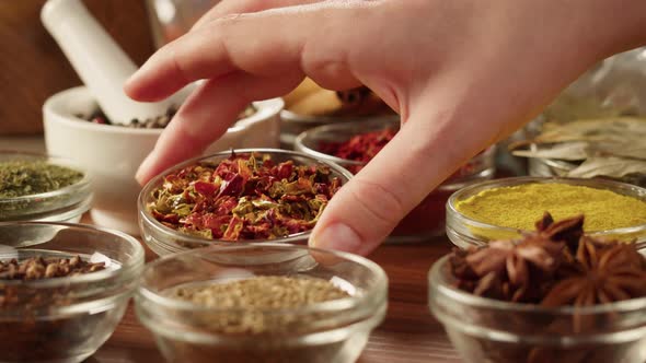 Colourful Spices in Glass Bowls Closeup alt