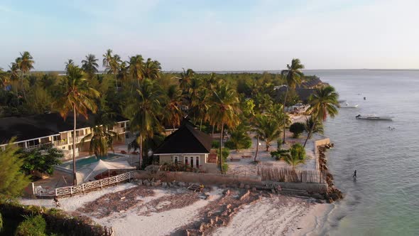 Paradise Beach Resort with Palm Trees and Hotels By Ocean Zanzibar Aerial View alt