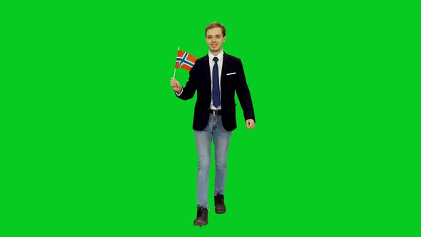Young Happy Businessman Walking with Waving Flag of Norway on Green Screen