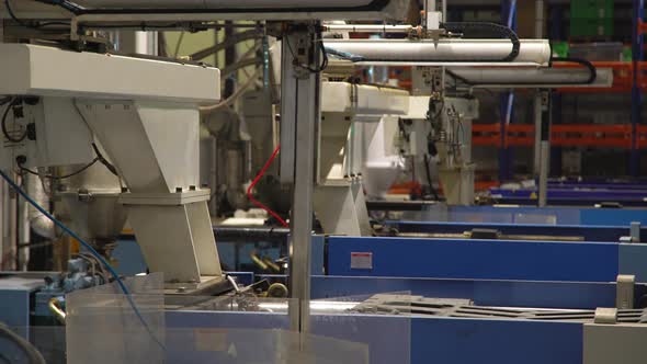 Robotic Arms In Plastic Factory alt