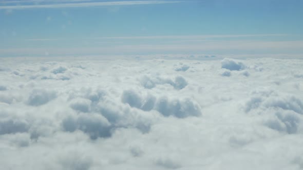 Shooting Thick White Clouds Through an Airplane Window