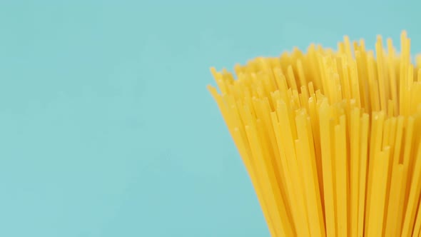 Pasta Spaghetti Closeup on a Blue Background Rotates