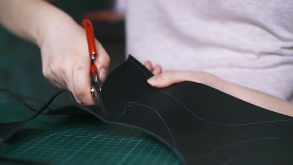 Skilled Designer Cuts Black Leather Cloth Making Mask alt