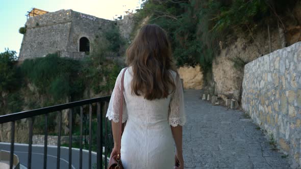 Young Woman Walks the Streets of the Old City of Ulcinj