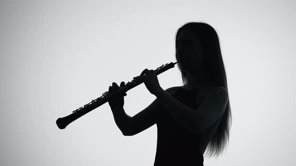 Musician Girl Playing an Oboe