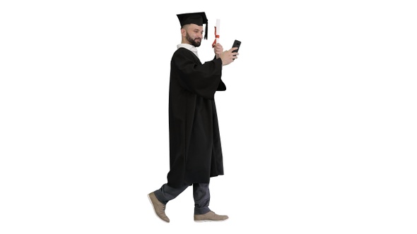 Mature Graduate Student Taking Selfie While Walking On alt