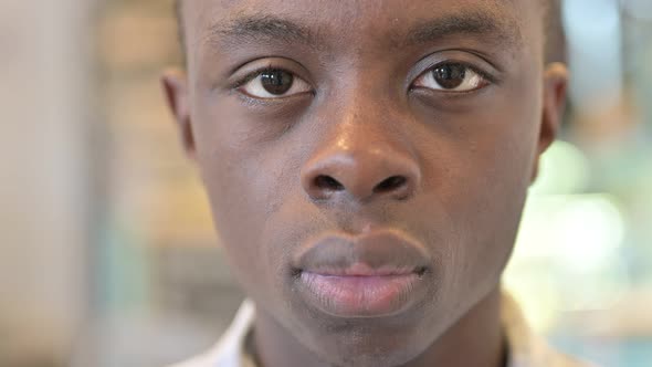 Face Close up of African Man Looking at Camera alt