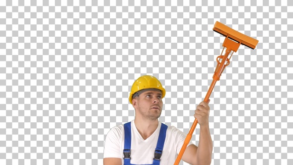 Smiling mid adult worker cleaning window with squeegee alt