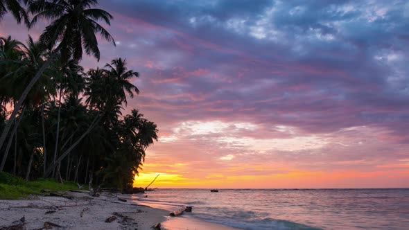 Time lapse: sunset over tropical beach and sea colorful dramatic