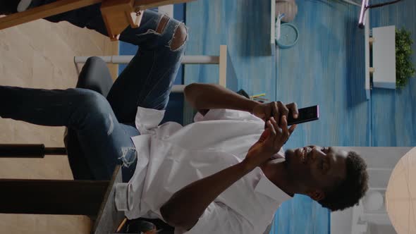 Vertical Video African American Adult Using Smartphone for Drawing Process alt