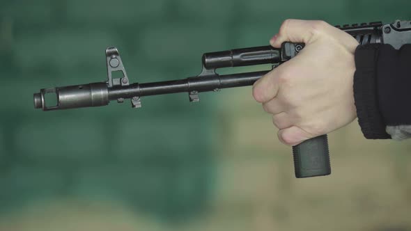 Rifle Shooter During Shooting. Close-up alt