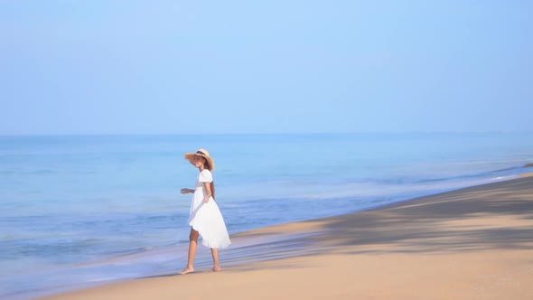 Asian woman enjoy around beautiful beach sea ocean alt
