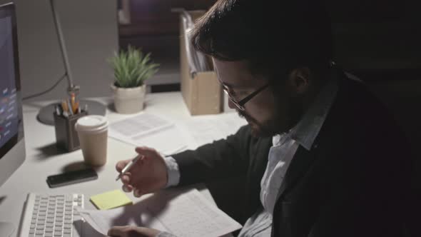 Man Analyzing Financial Data alt