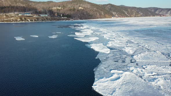 4k, Flight over Baikal lake and Angara river in winter