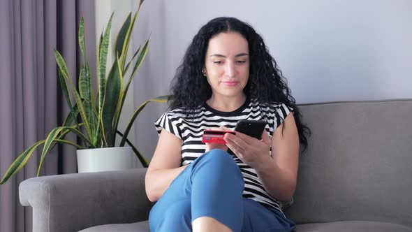 Young Woman in Beautiful Sunny Day Making Online a Purchase Easy Payment on the Internet Using a alt