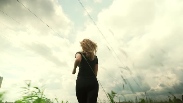 Running Legs And Foot. Woman Running Workout. Fit Woman Cardio Training. Runner Workout On Grass. alt