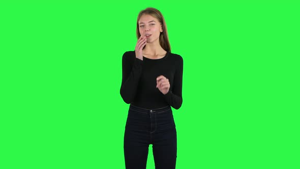 Young Woman Showing Heart with Fingers Then Blowing Kiss. Green Screen alt