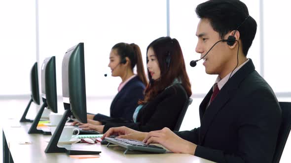 Business People Wearing Headset Working in Office alt
