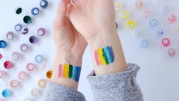 Rainbow LGBTQ Flag Painted on Hand alt