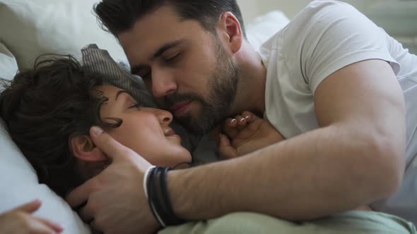 Attractive Couple Kissing Tender in Morning After Waking Up Spbd alt