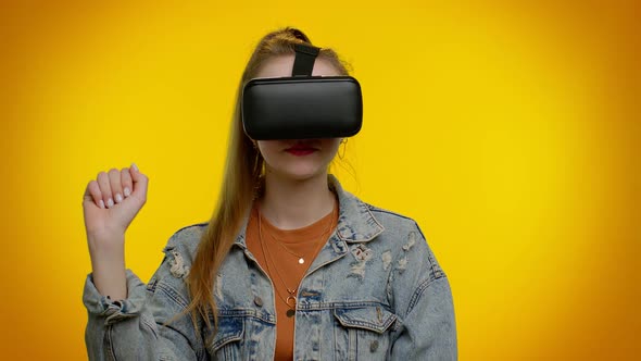 Girl Using Virtual Reality Futuristic Technology VR Headset Helmet to Play Simulation 3D Video Game alt