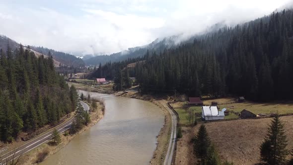 Flying Over the River in Mountains