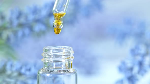 Super Slow Motion Shot of Oily Essence Drop Into Phial at 1000Fps alt