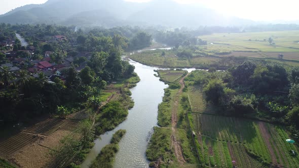 Vang Vieng city in Laos seen from the sky alt
