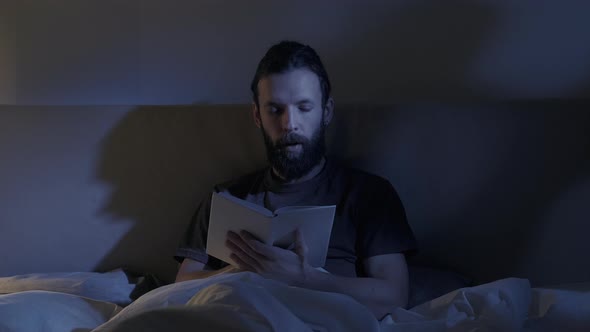 Bed Reading Night Fatigue Sleepy Man Closing Book alt