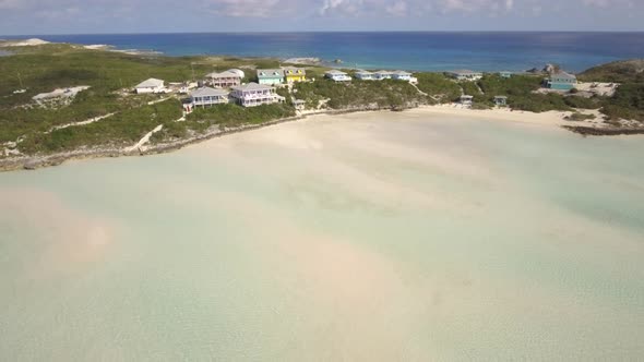 Aerial drone view clear water, houses on tropical island beach and coast in the Bahamas, Caribbean.  alt