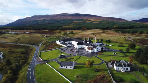 Aerial Pan Around of a Distillery and Farmland in Dalwhinnie Scotland alt